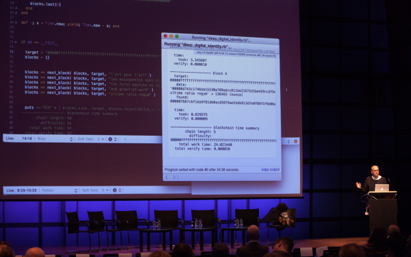 A man standing behind a podium and giving a talk.