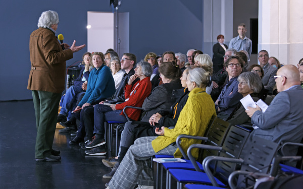 A man talking to the audience