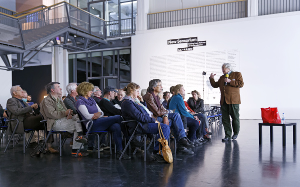 A man talking to the audience