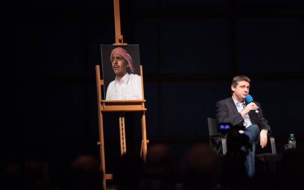 On an easel is a picture of a man with a turban