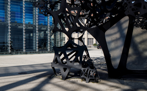 On the left is a part of the ZKM Cube with a video wall, on the right the squiggly architecture of the Sound Pavilion The Morning Line protrudes into the picture.