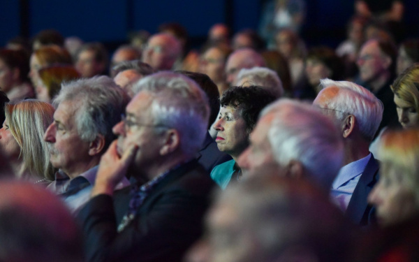 The audience follows the award.