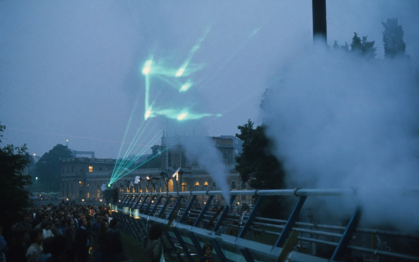  The picture shows a green laser show with audience