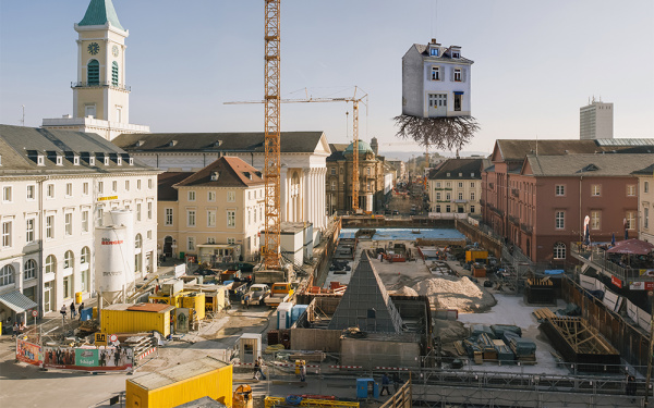 House suspended from a crane