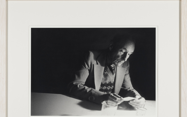 William Burroughs looking at a photograph at Brion Gysin’s Paris flat, shortly after their participation in the ten days One World Poetry Festival in Amsterdam, in October 1979