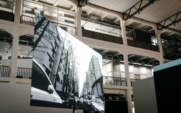 In the picture you can see a hanging screen that shows a street in black and white.