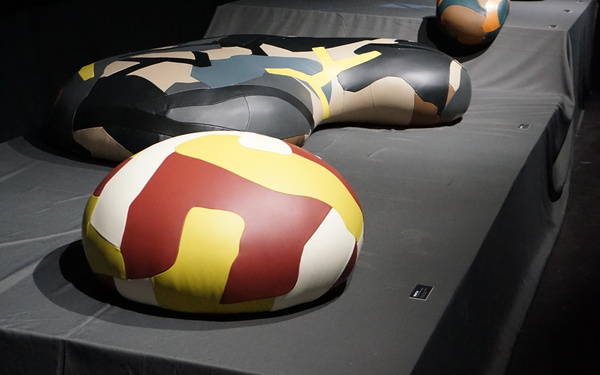 Several upholstered objects made from leather scraps can be seen in this picture.