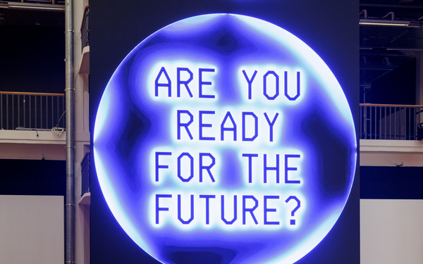 The image shows a huge screen displaying text.  