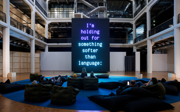 The image shows a huge screen displaying text.  