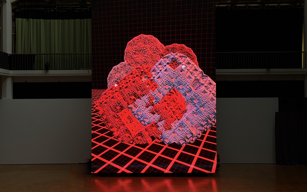 A huge screen displaying an abstract work of art.