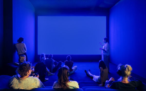 A blue room with a blue screen.