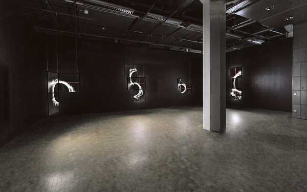 A room with screens featuring bright semicircles.