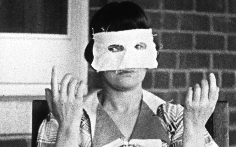 A woman wearing a white eye mask
