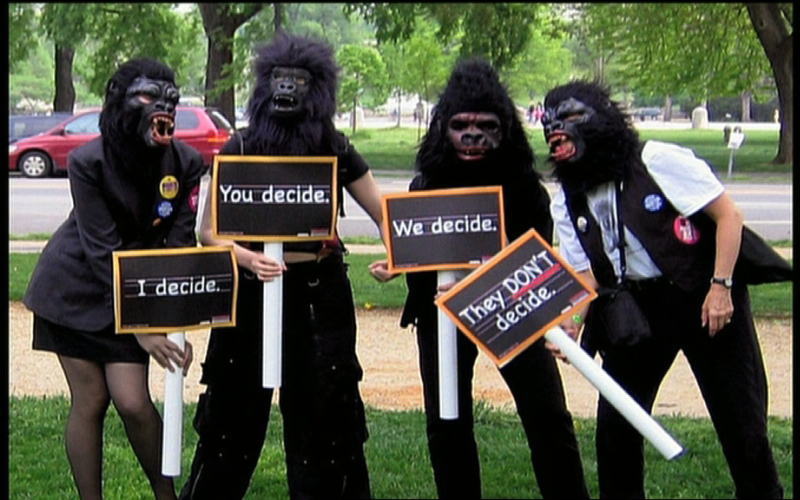 Protesters with monkey costumes