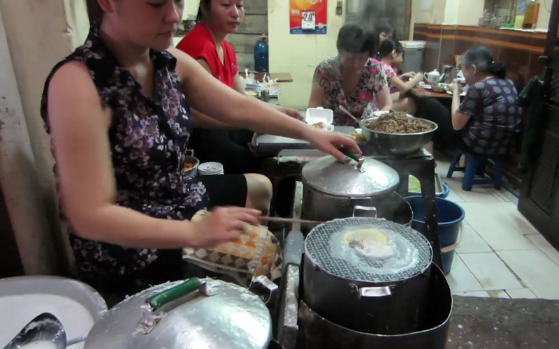 Asian Women during cooking