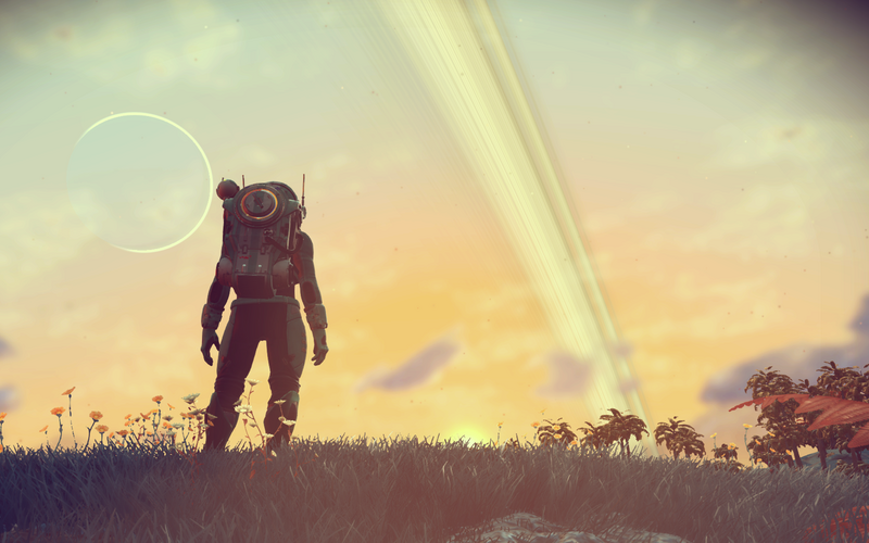 Ein Atronaut steht auf einer Wiese vor einer Himmelkulisse